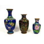 Chinese cloisonne baluster vase with flowers on a blue ground, H.24.3cm; smaller vase, H.15.3cm, and