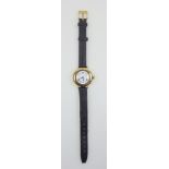 Ladies foreign 18ct gold wristwatch with a white enamelled circular dial enclosing a Swiss side-wind