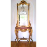 19th century pier glass with an upright bevelled mirror back, carved gilt floral and scroll