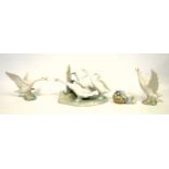 Lladro porcelain group of 3 geese, W.23cm; mother duck with ducklings in basket, W.9cm; and 2