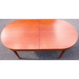 Mid-Century Danish Mogens Kold Teak dining table, the sliding top with rounded ends extending to