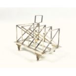 Victorian silver 4 division toast rack, the bars of rectangular form with cross supports, with a