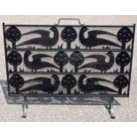 C F A Voysey style cast iron and wire mesh fire screen, the stylised design with 3 rows of flowers