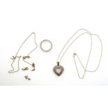 9ct gold heart shaped pendant set diamonds, stamped 375 on a yellow metal fine link necklace with