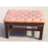 Rectangular mahogany stool upholstered in brass studded buttoned hide, 37 x 65 x 45cm