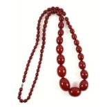 Cherry amber oval bead necklace with barrel clasp, largest bead L.3cm, L.99cm, 122.6grs