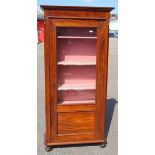 Walnut display cabinet with a glazed panelled door, enclosing a fabric lined interior with