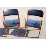 Pair of Danish Erik Buch Model 50 teak dining chairs with open arms and upholstered in black