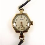 Rotary 9ct gold lady's wrist watch with a circular dial, seconds dial, and Arabic numerals,