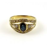 Yellow metal ring set oval sapphire and 26 diamonds, stamped "750", 4.6grs