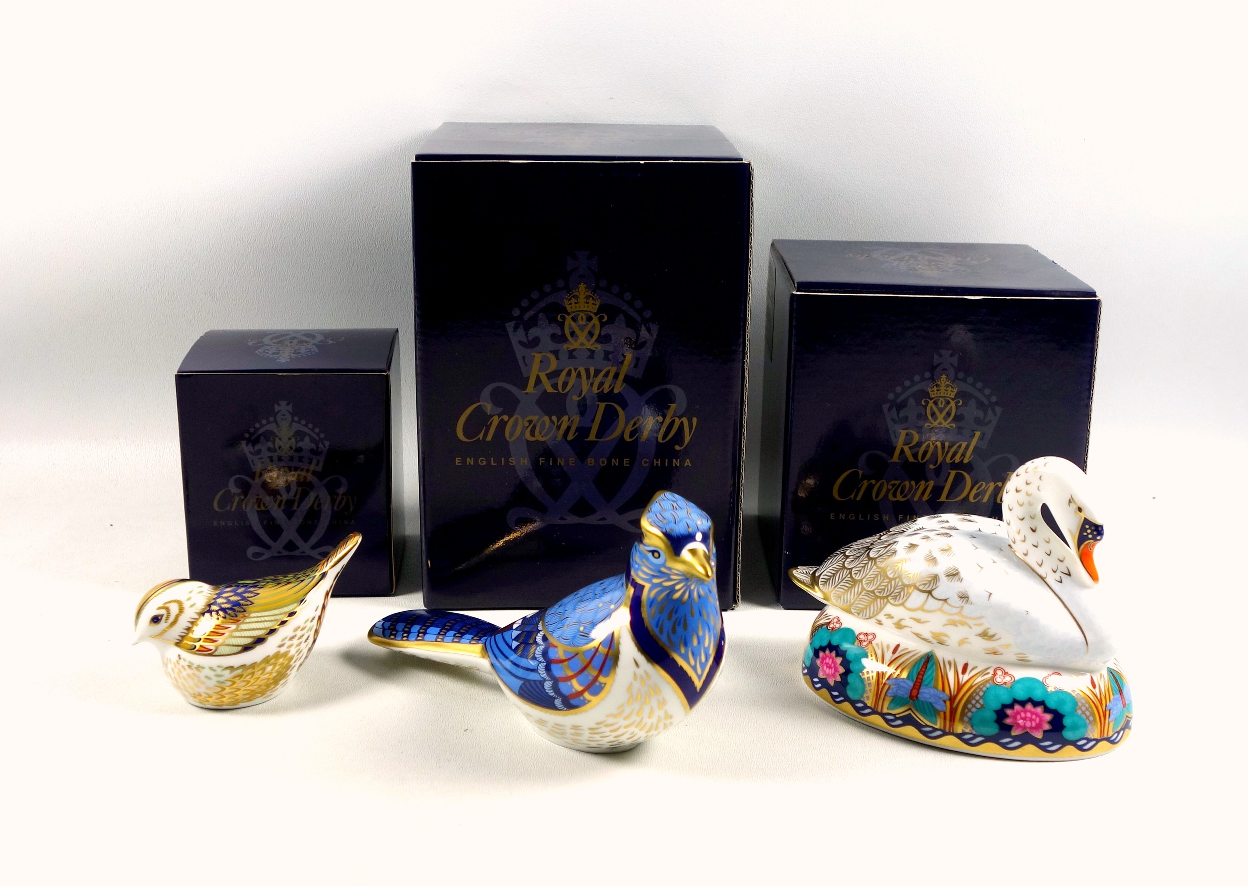 Royal Crown Derby Swan paperweight, W.13cm; Blue Jay, W.17.5cm; and Firecrest, for the Royal Crown