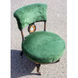 Late Victorian ebonised nursing chair with gilt fluting and open curved back with an inset oval