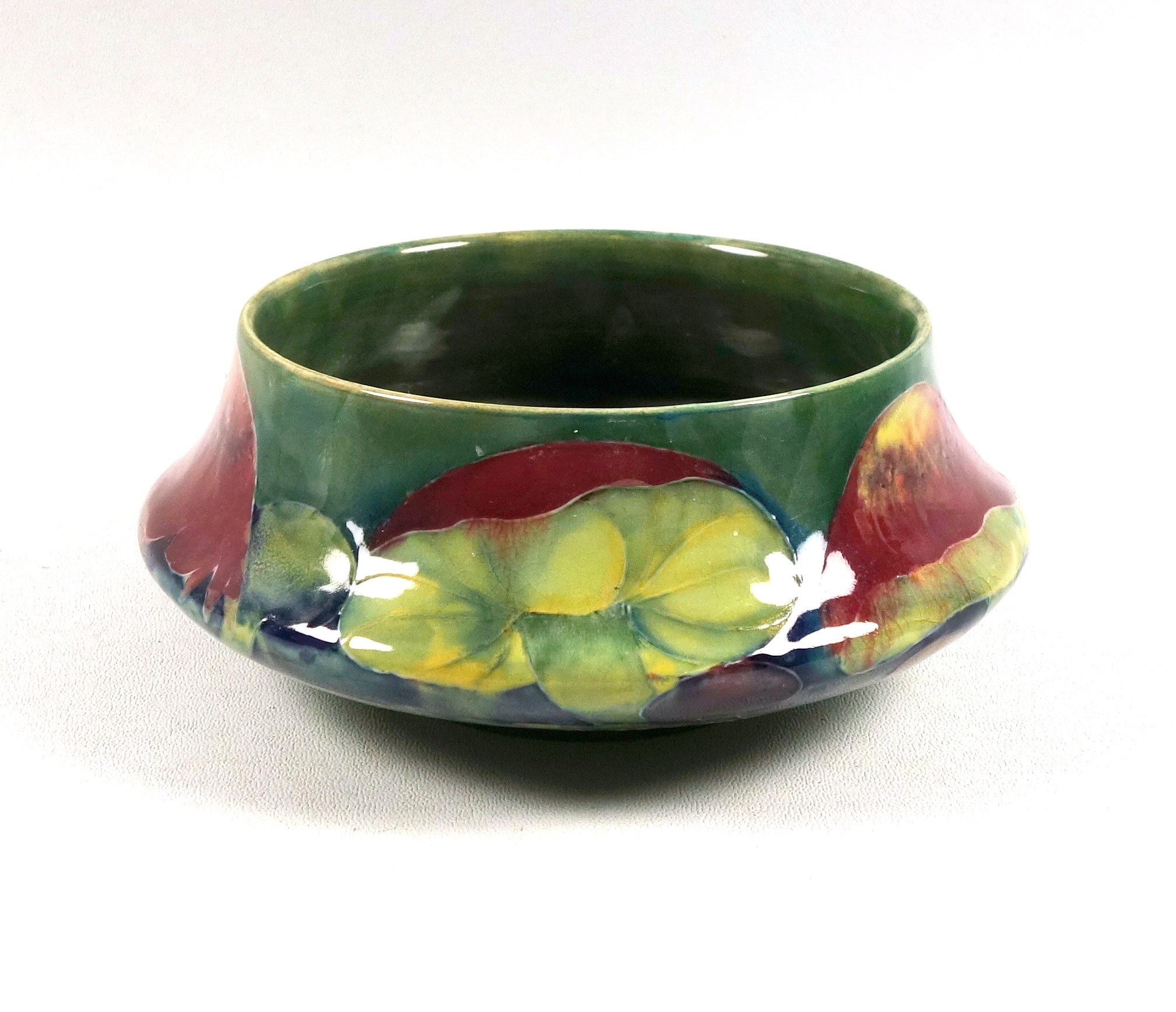 William Moorcroft "Claremont" pattern bowl, of footed squat shouldered form, decorated with
