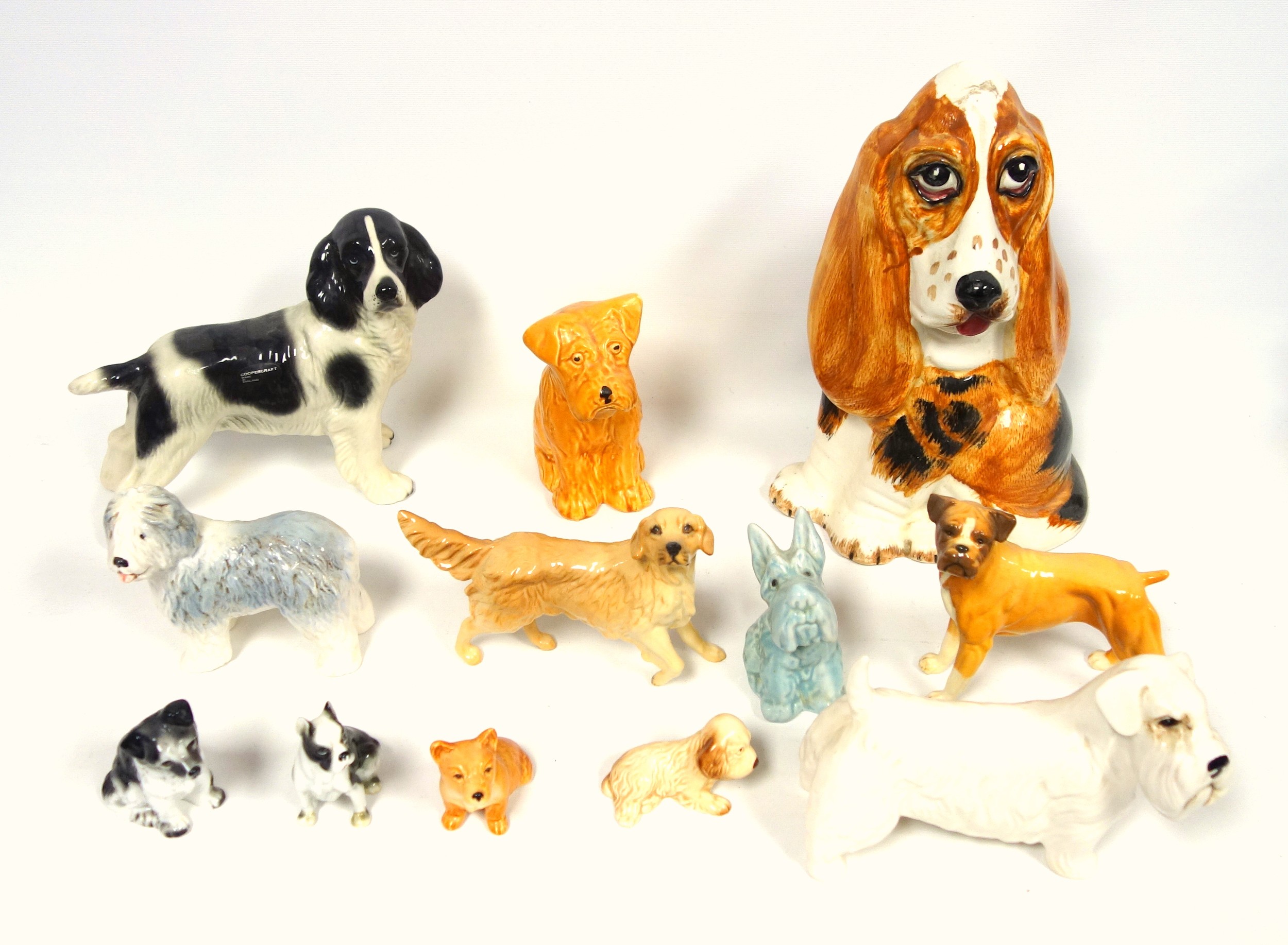Sylvac, Beswick, Price, and other figures of various breeds of dogs, largest H.30cm. (12)
