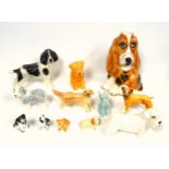 Sylvac, Beswick, Price, and other figures of various breeds of dogs, largest H.30cm. (12)