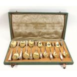 Set of 12 German silver coffee spoons with gilt bowls, the handles with beaded borders, and