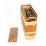 Wooden box containing 40 gold finishing hand tools comprising complete alphabet, numbers 0-9,