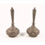 Pair of 19th century Persian white metal rosewater bottles, of globe and shaft form with domed cover