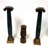Pair of brass and coated metal ionic column cylindrical candlesticks, each on a stepped base, H.