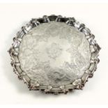 George III silver salver with chased floral and foliate decoration, later engraved central cartouche