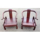 Pair of Chinese hardwood horseshoe back armchairs, 74.5 x 67 x 68cm, (a/f). (2)