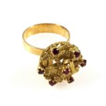 Yellow metal ring with 7 sapphires in a floral setting, stamped "750", 8.5grs, cased. (2)