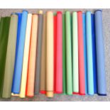 12 rolls of buckram in various colours, differing quantities on each roll. (12)