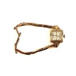 Cyma 9ct gold lady's bracelet watch with a square dial, baton and a 12 numeral, enclosing a side