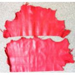 2 large part goat skins, dyed oxblood, few imperfections, largest 109 x 57cm at widest points; 4