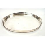 Silver plated copper oval tray with a pierced gallery, and gadrooned shaped rim, on turned feet, W.