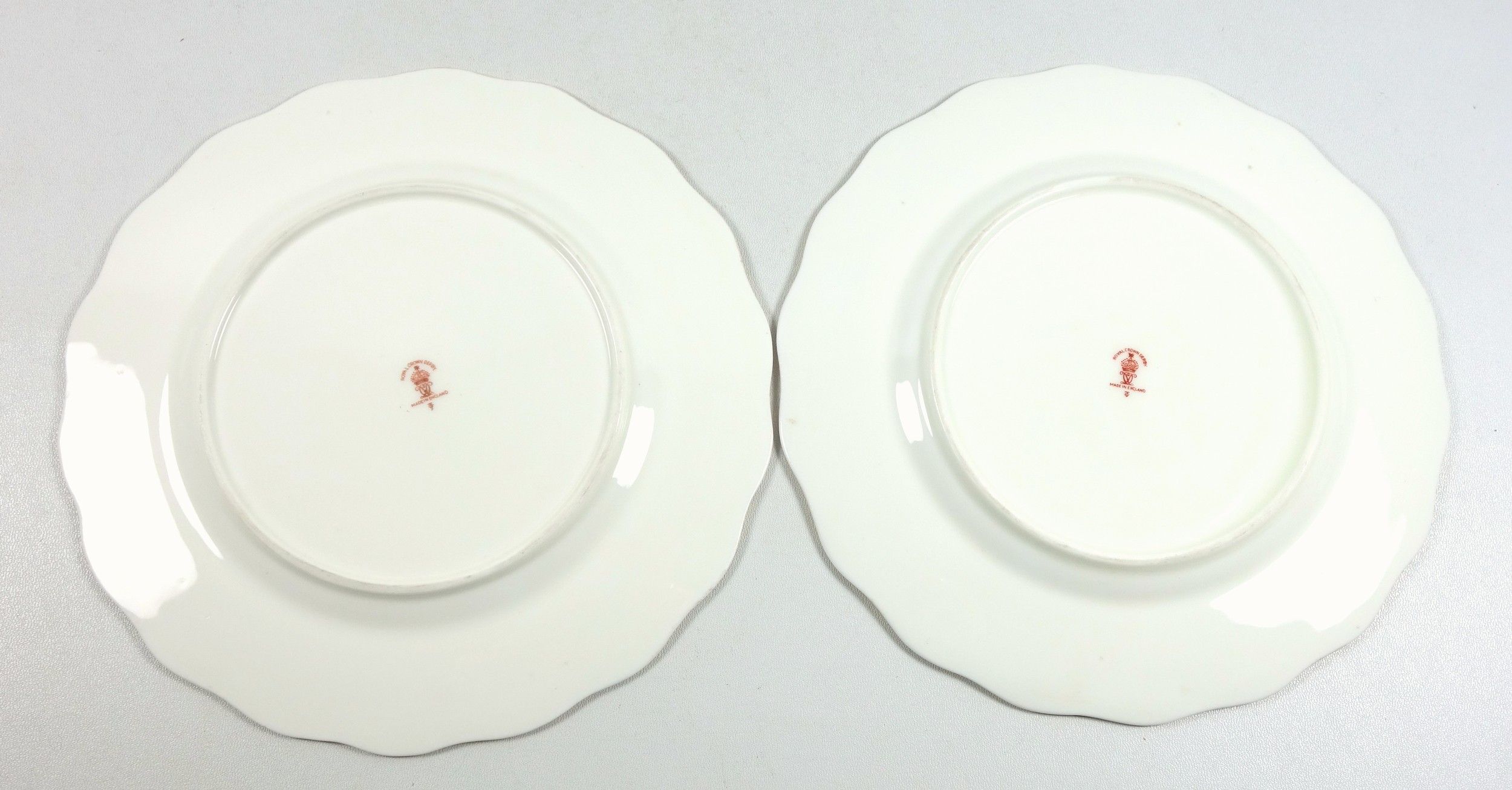 2 Royal Crown Derby plates, each painted with a water landscape, signed W E J Dean, within - Image 4 of 4