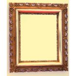 Victorian wall mirror with an upright rectangular plate in a gilt moulded pierced scroll and