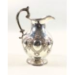 Victorian silver milk jug of baluster form with beaded rim, twin c-scroll handle, repousse and