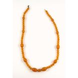 Amber necklace with oval and spherical beads, largest 1.8cm, L.54cm, 29grs, (ring clasp detached)