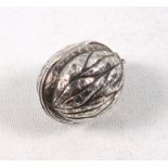 Late Victorian silver vinaigrette in the form of a walnut, the hinged cover, rising to disclose a