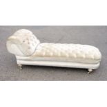 Victorian scroll end day bed with buttoned cream velour upholstery, on turned legs and ceramic