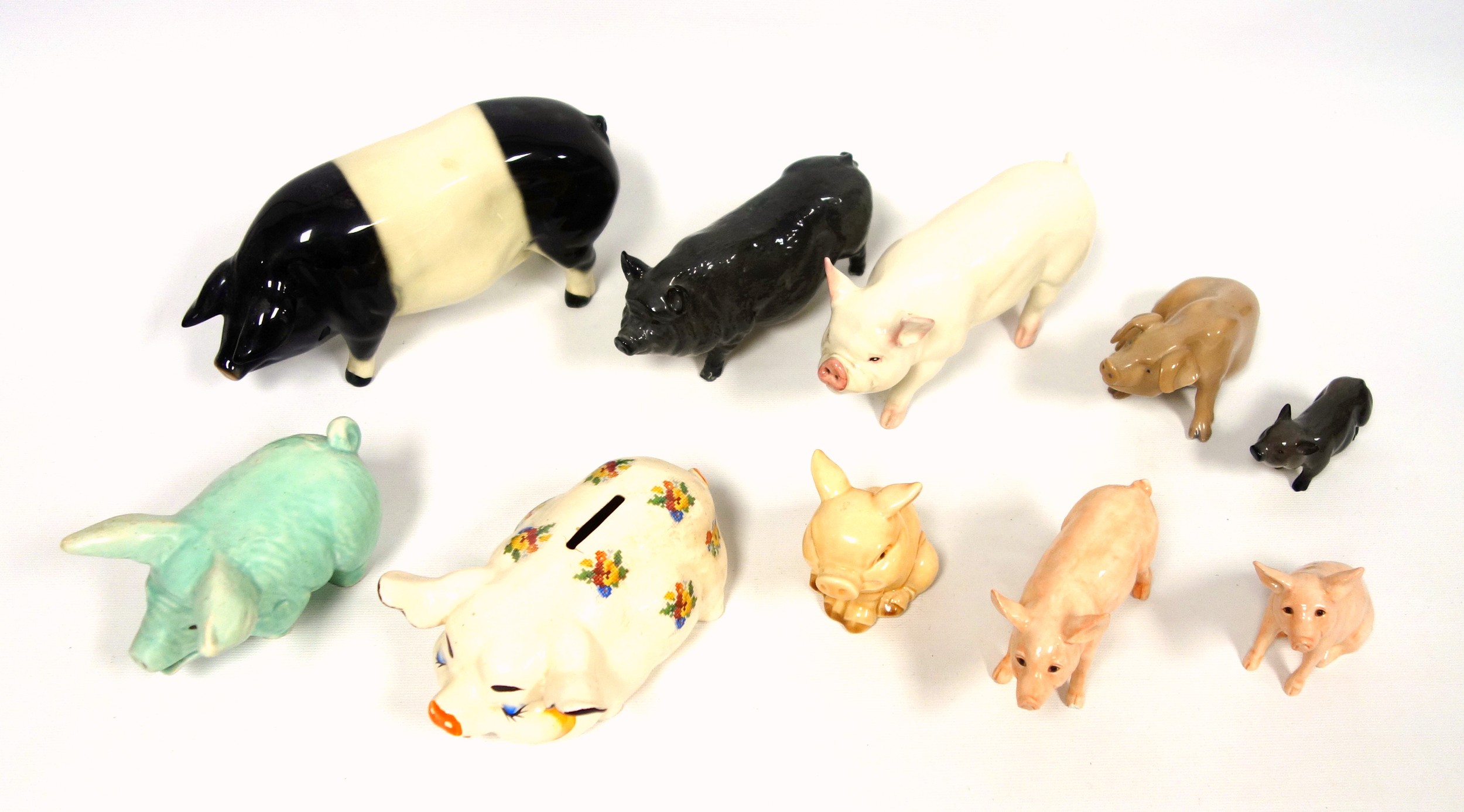 Bing and Grondahl, Price, Beswick, Royal Doulton and other figures of pigs, largest W.22cm. (10)