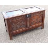 Late 17th Century oak chest with a double panelled hinged top and carved double panelled front, on