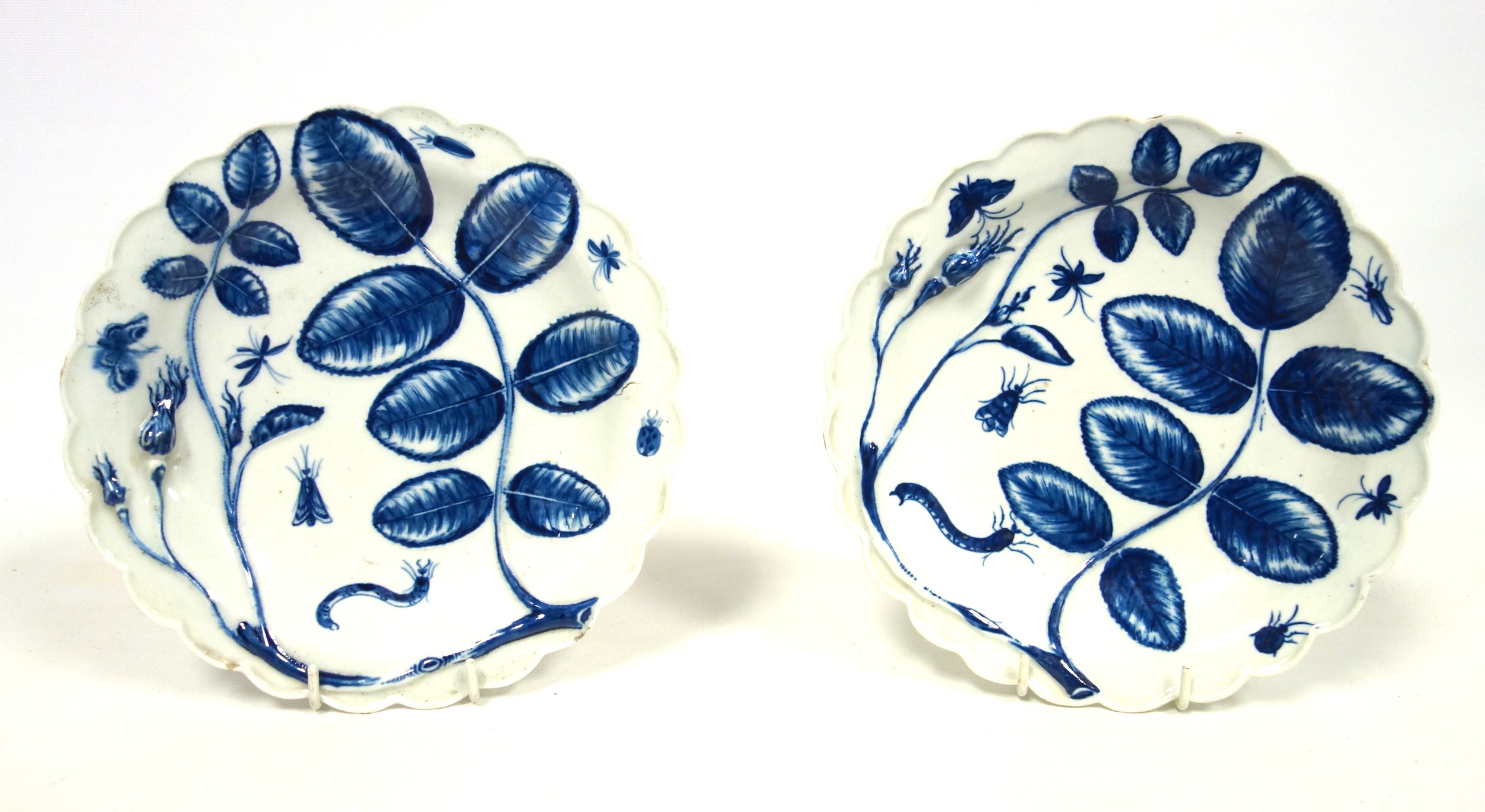 Pair of Worcester First Period circular plates, each with painted blue and white rose buds,