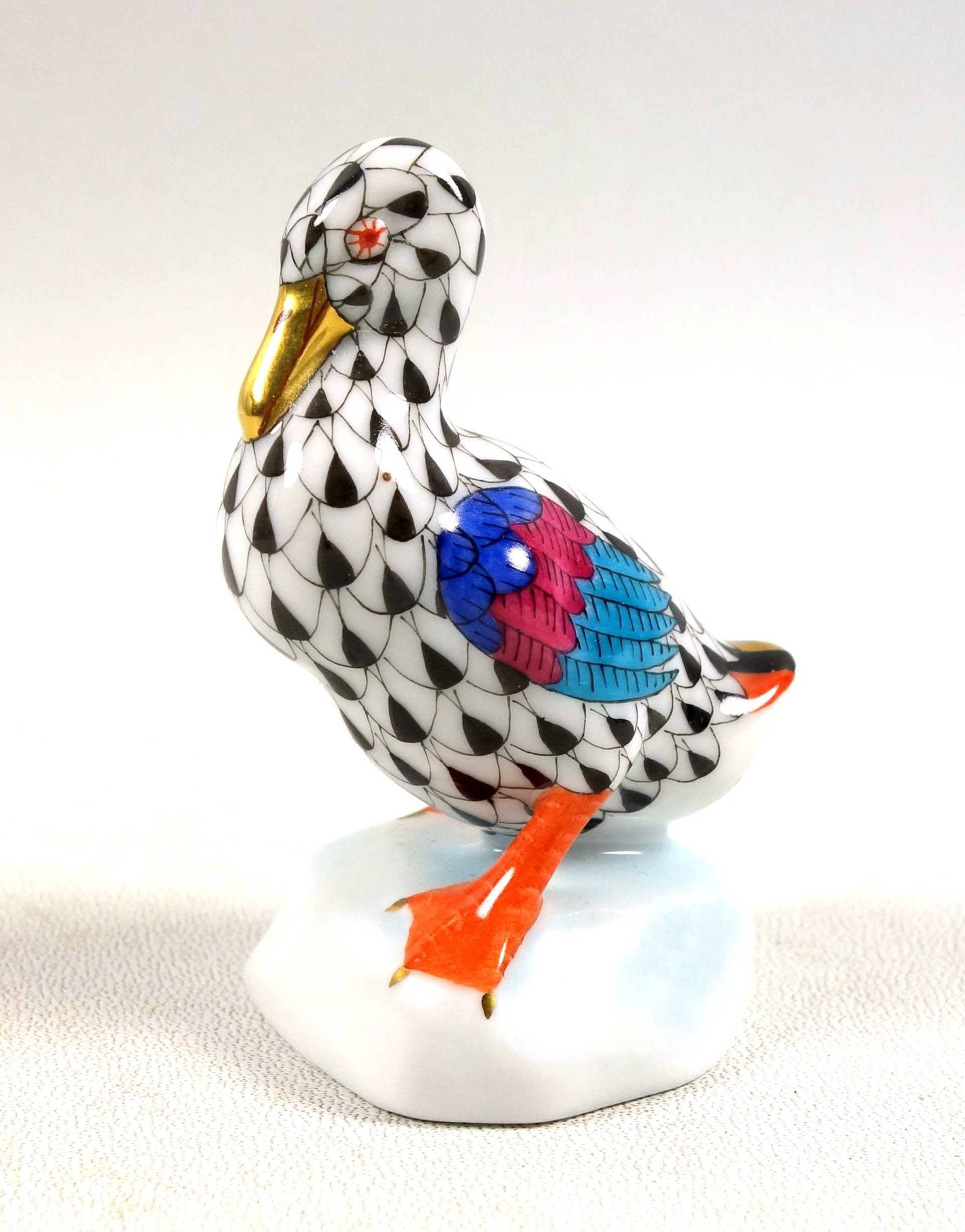 Herend porcelain duck, with black feather tips, tricolour wings and gold highlights, signed to the