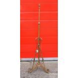 Edwardian brass lamp standard with an adjustable column and scroll supports, on 3 shaped feet, H.