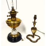 Edwardian brass oil lamp adapted to electricity, H.39cm, and an Indian brass serpent lamp, H.