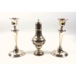 Pair of George V silver candlesticks with reeded bands and tapering column, on a circular base, by W