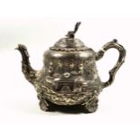 Victorian silver teapot of inverted pear form, chased and embossed with 2 scenes of figures at a