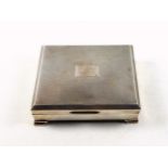 Elizabeth II silver cigarette box with vacant cartouche and engine turned decoration, on 4 stepped