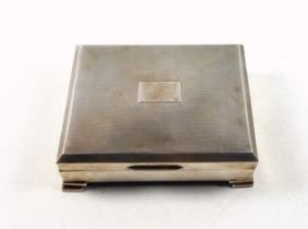 Elizabeth II silver cigarette box with vacant cartouche and engine turned decoration, on 4 stepped