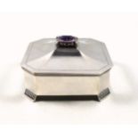 Swedish silver canted square dressing table box with a cover set with an amethyst, 21 x 16mm, on 4