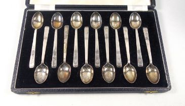 George VI set of 12 silver coffee spoons, Each initialled “B”, by Walker and Hall, Sheffield,