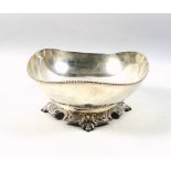 White metal pedestal elliptical bowl with a beaded rim, on an embossed foot, marked "Silver", W.19.