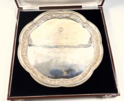 Indian white metal octafoil presentation salver, with a beaded rim and floral embossed border,